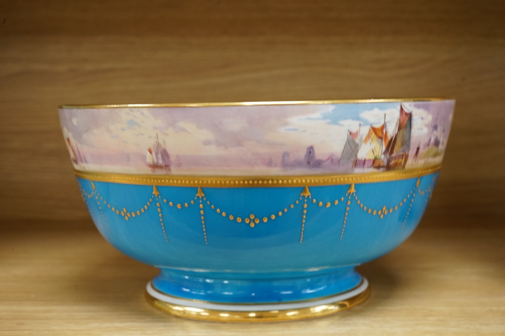A 19th century Mintons bowl hand-painted by W J Dean, with boats to the top rim, 25cm in diameter